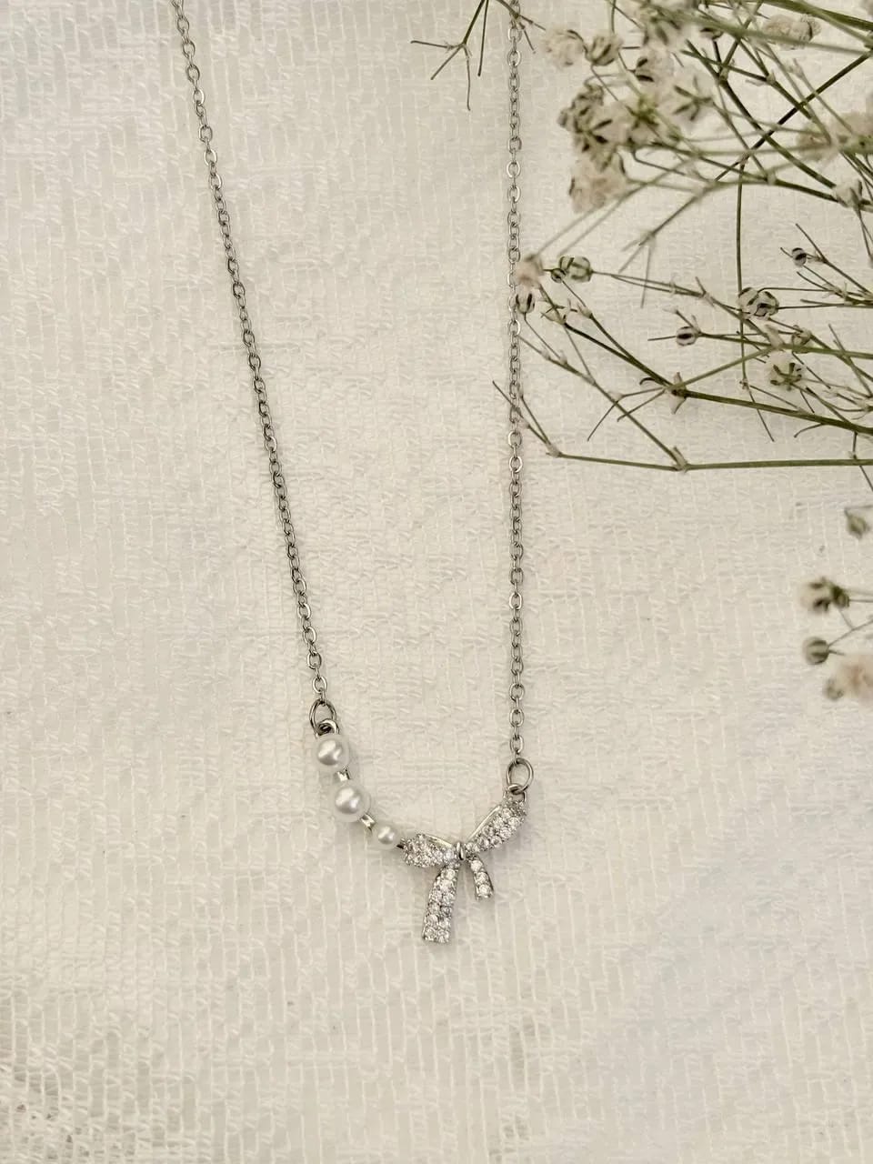 Silver Bow Necklace — Necklaces